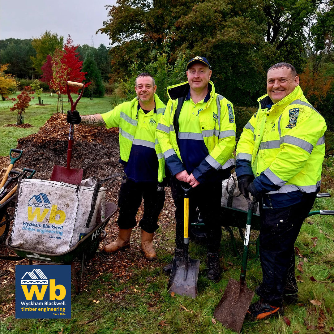Members of the Wyckham Blackwell team, helping to upgrade the walkways and spread bark chippings in the local woodland for the Hampton Conservation Group