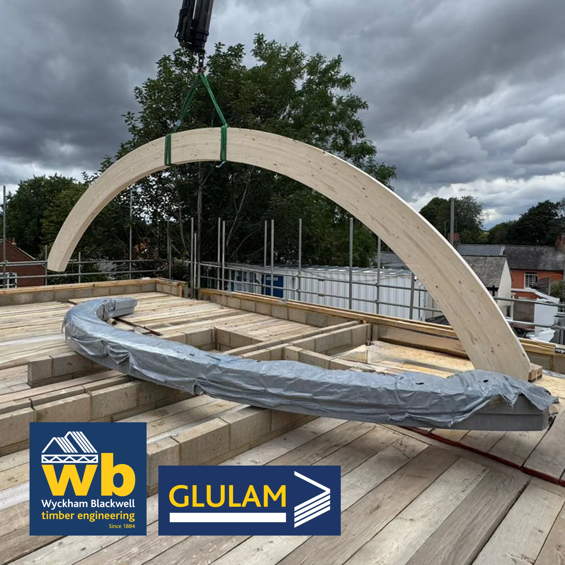 Six 7.5m span, 140mm x 400mm, 4.2m radius, Glulam Structural Curved Portal Beams being installed this week for a pair of new build houses in St Albans.