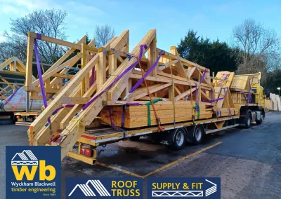 A Wyckham Blackwell branded, articulated flatbed lorry transporting two full loads of roof trusses to a client in Bedford.