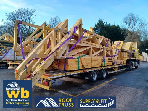 A Wyckham Blackwell branded, articulated flatbed lorry transporting two full loads of roof trusses to a client in Bedford.