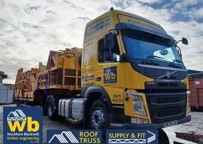 A Wyckham Blackwell branded, articulated flatbed lorry transporting two full loads of roof trusses to a client in Bedford.